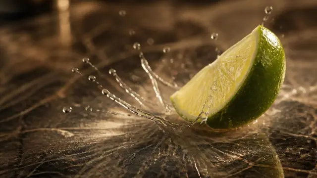 Lime juice etching a polished marble surface on contact