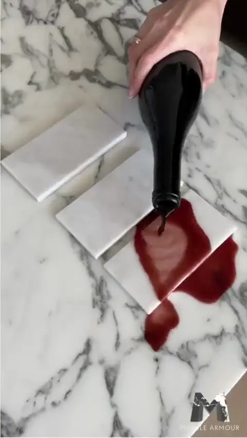RAKU nanocoating being applied to natural stone samples